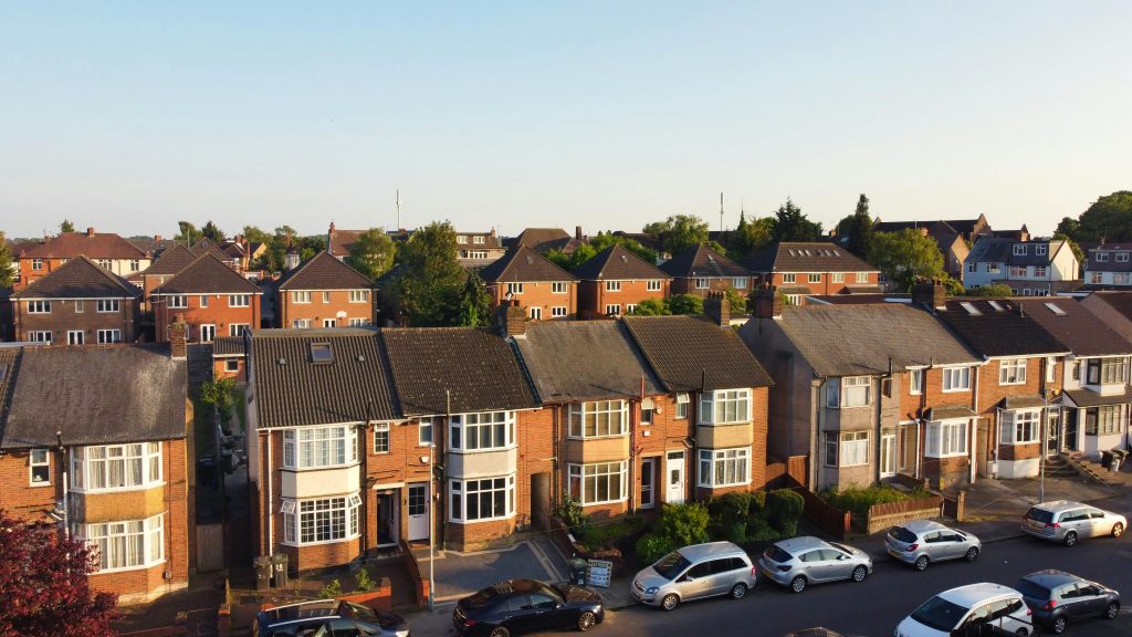 Residential street of well kept suburban homes in the UK, ideal example of managed rental properties in a property portfolio.